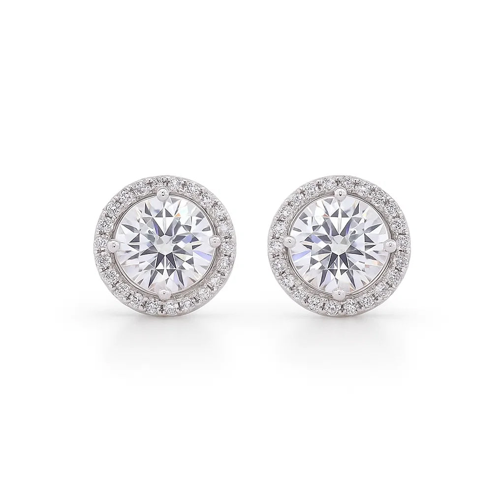 Pair of moissanite stud earrings on a white background
