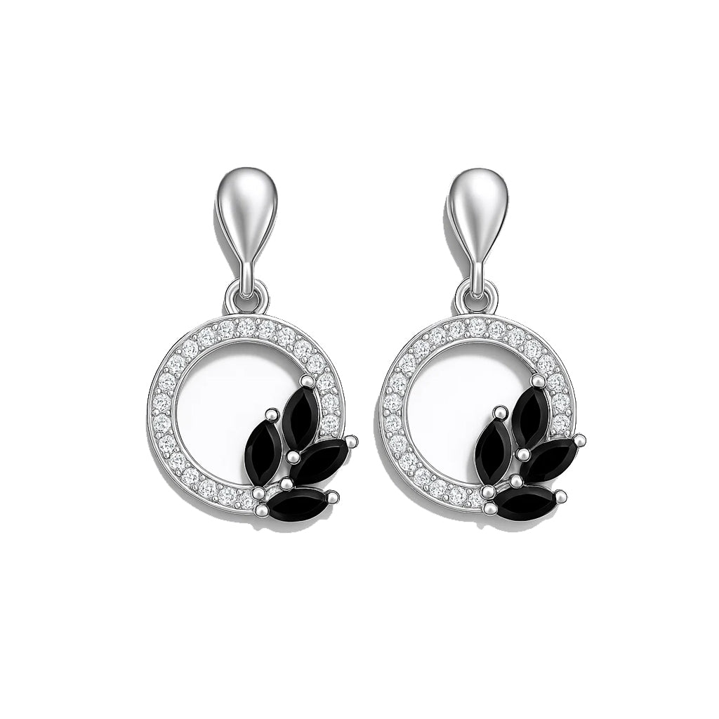 Pair of silver earrings with black stones on a white background