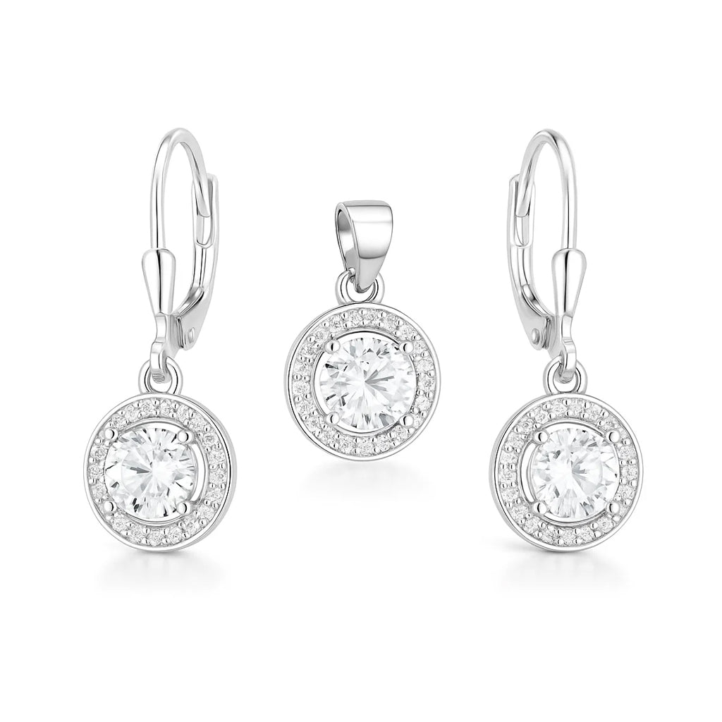 Silver earring set with round clear gemstones on a white background