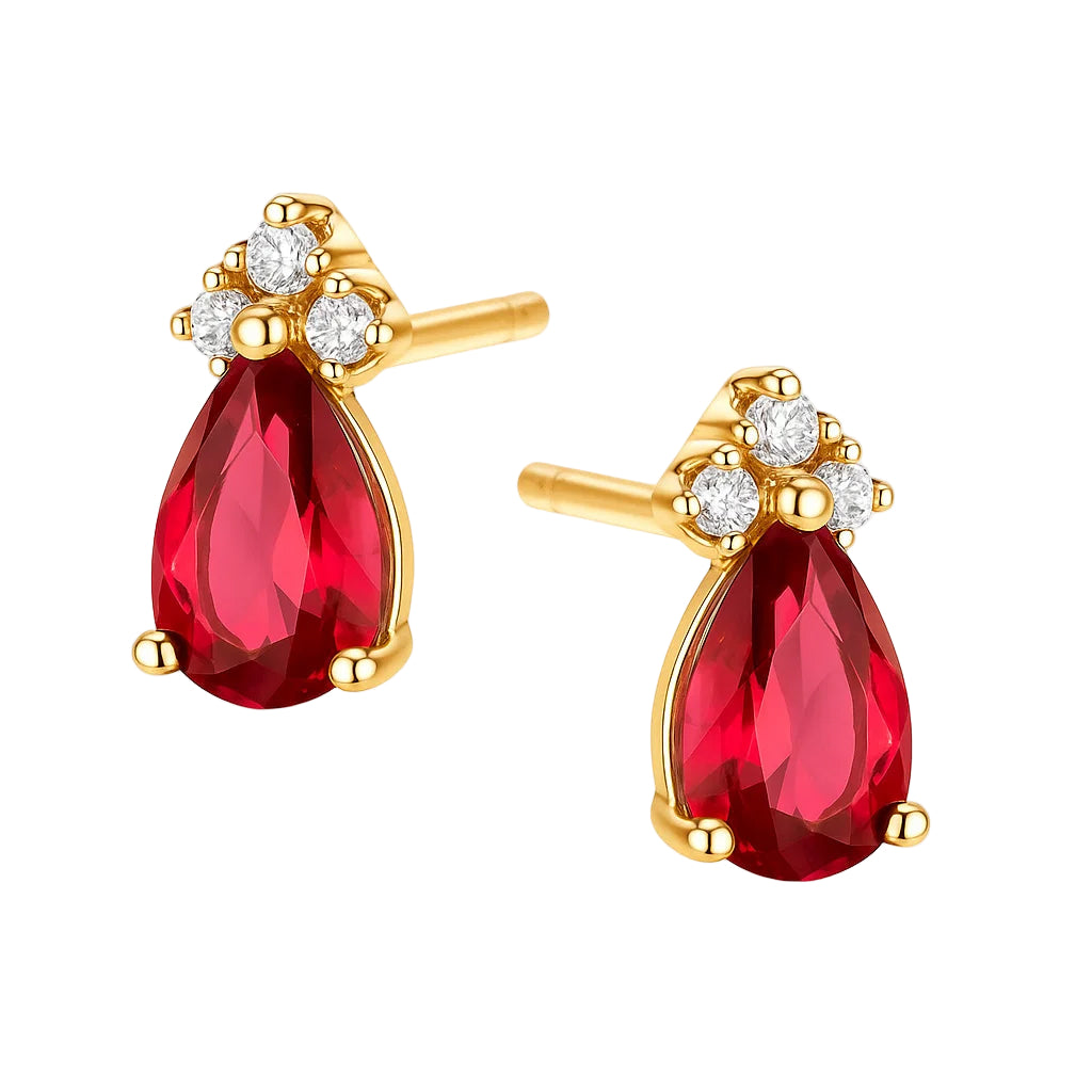 Gold earrings with red teardrop-shaped gemstones on a white background