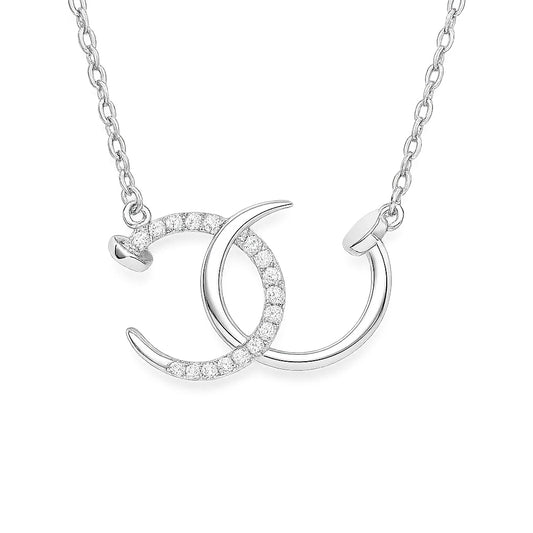 Silver necklace with a crescent moon and circle pendant on a white background