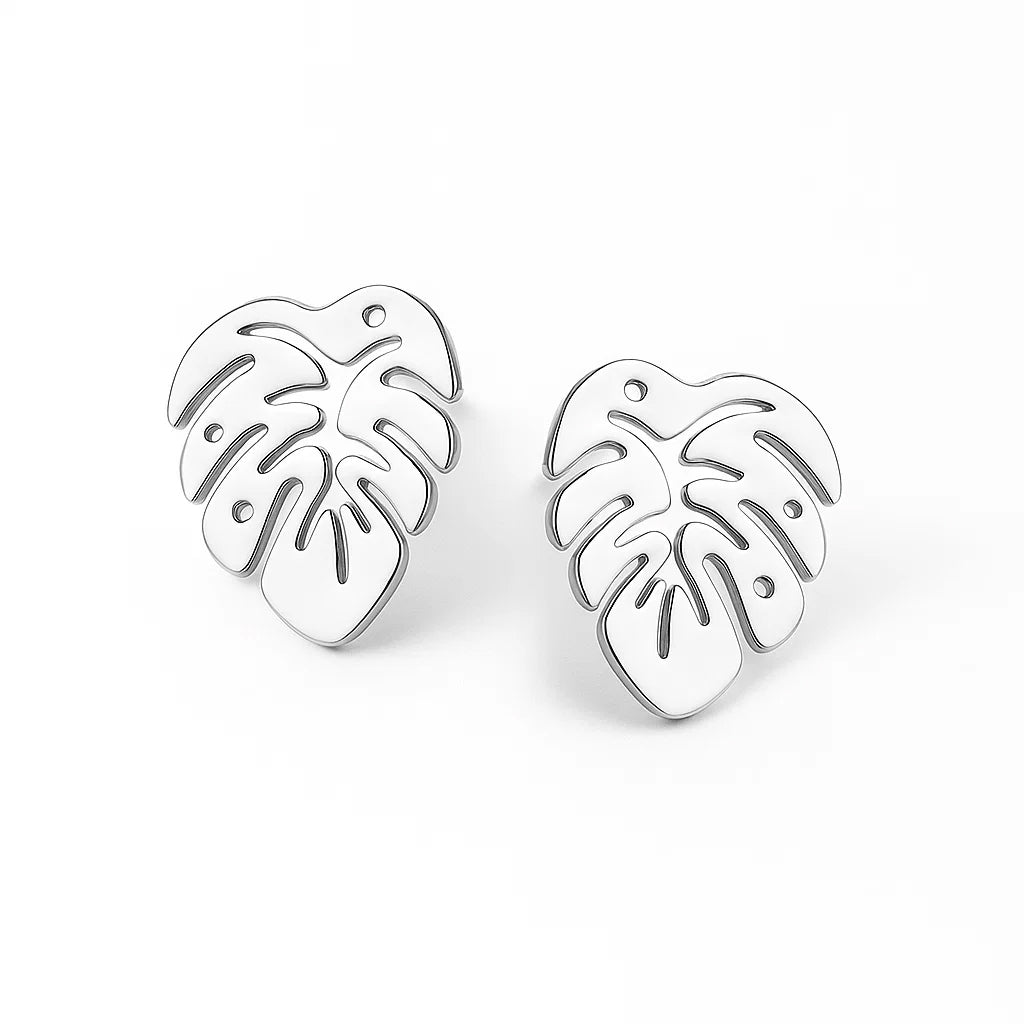 Silver leaf-shaped earrings on a white background