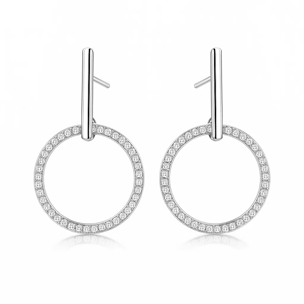 Pair of silver hoop earrings with small zirconia on a white background