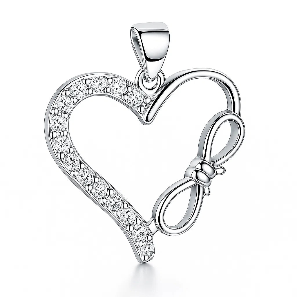 Silver heart-shaped pendant with bow design and clear stones on a white background