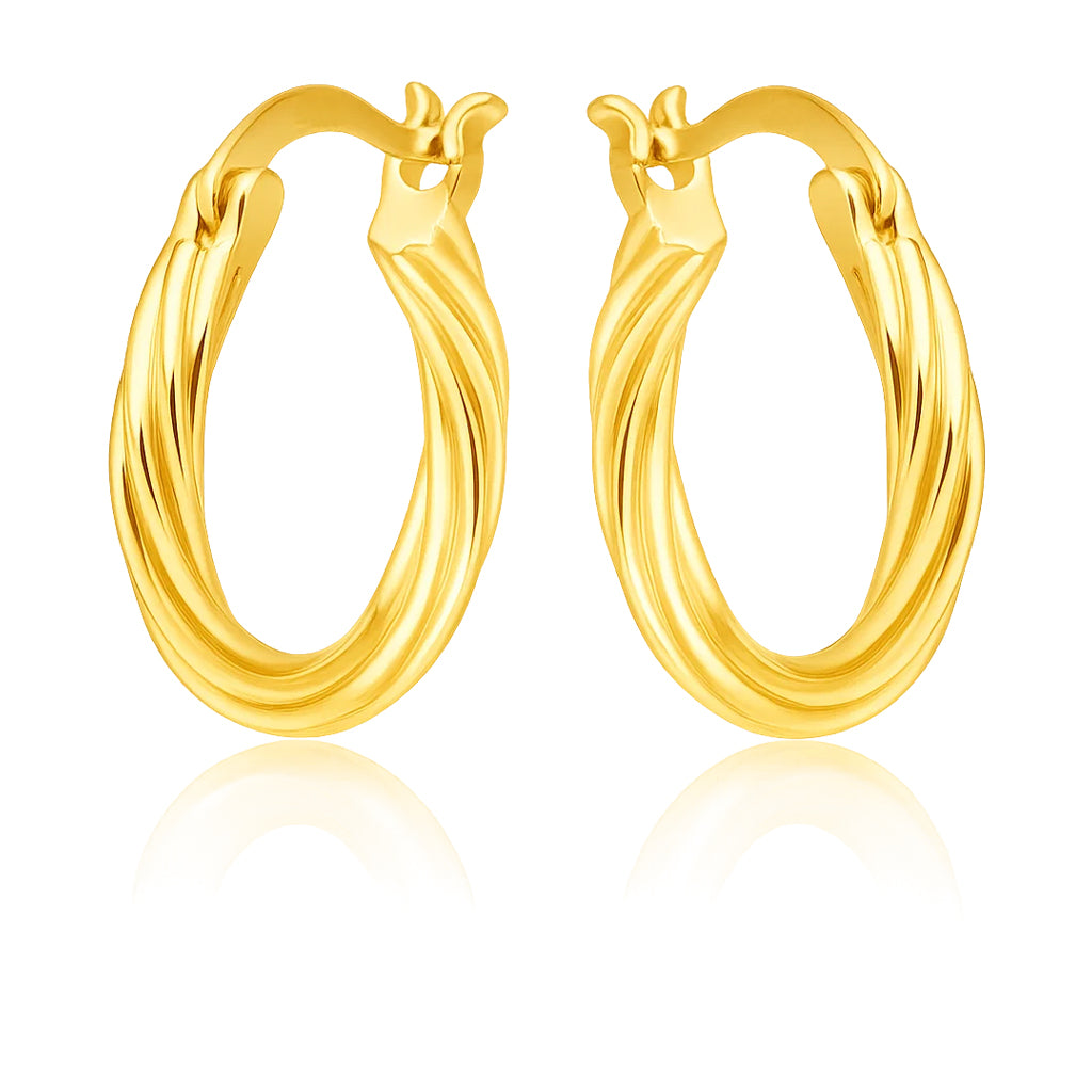 Pair of gold hoop earrings on a white background