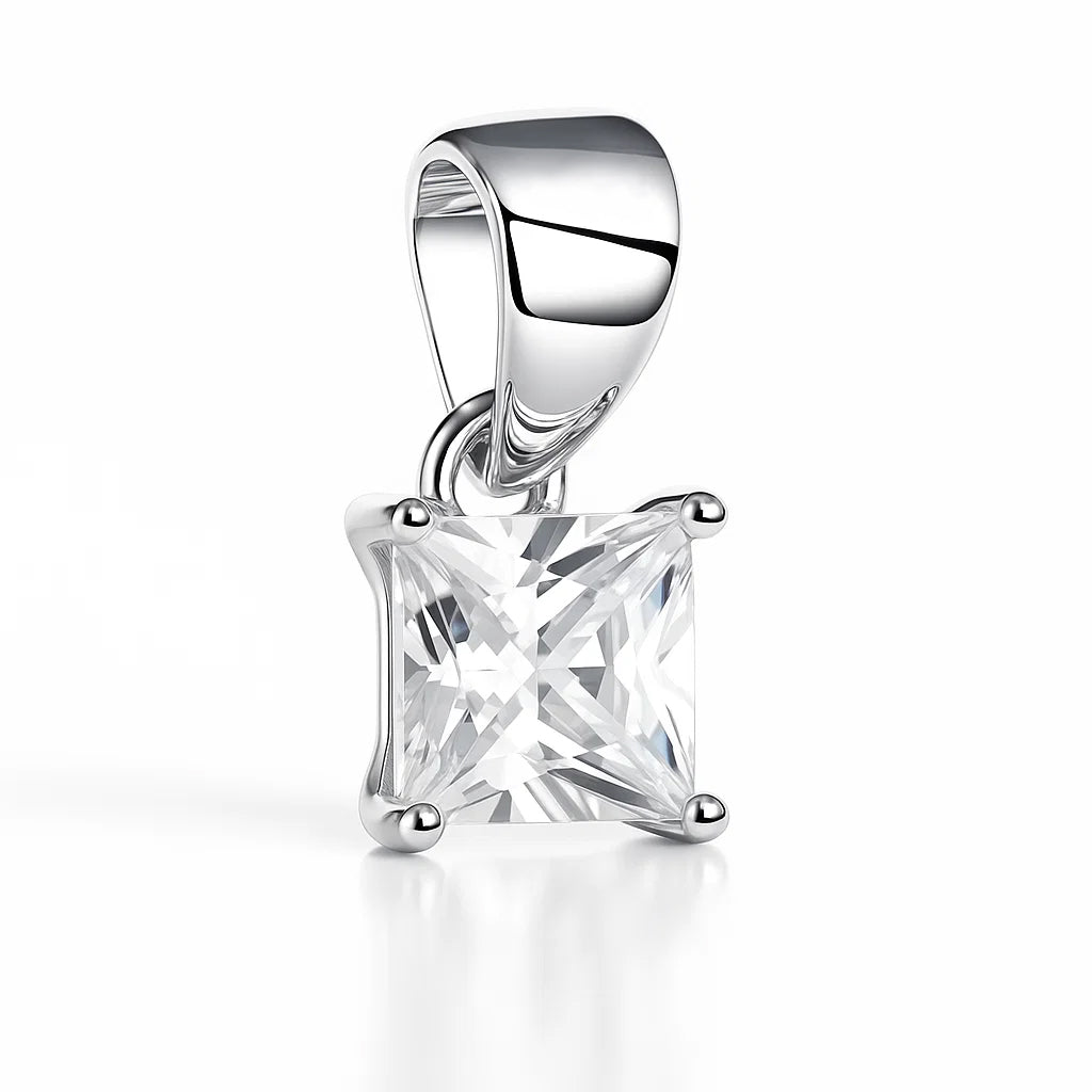 Silver pendant with a large clear gemstone on a white background