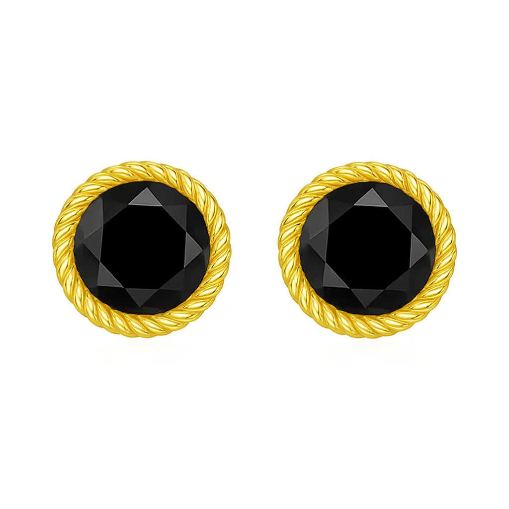 Pair of gold earrings with black gemstones on a white background
