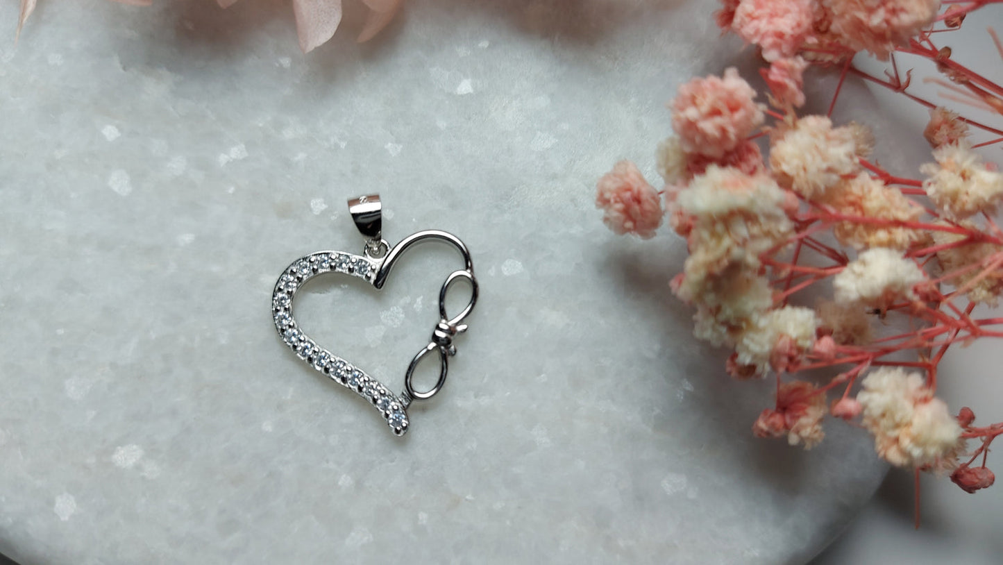 Hearth Shaped Silver Pendant Half Covered With CZ and Bowtie, Rhodium Plated - Amona Jewelry
