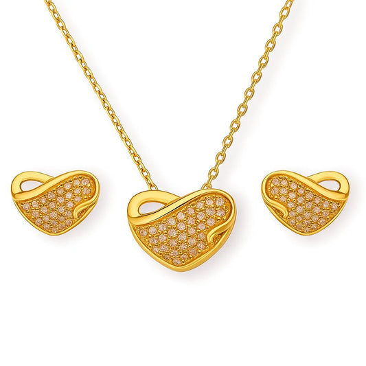Gold heart-shaped necklace and earrings on a white background