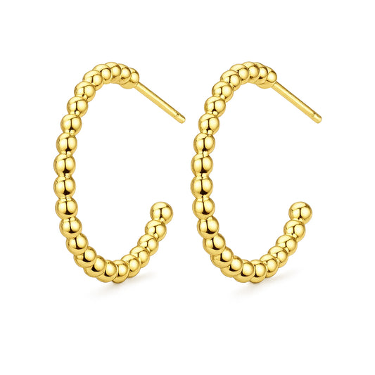 Gold hoop earrings with beaded design on a white background