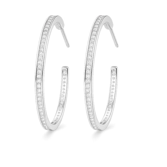 Pair of silver hoop earrings with embedded stones on a white background
