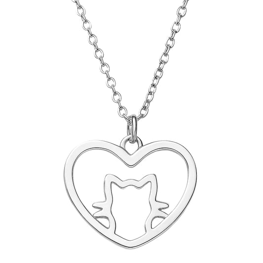 Silver heart-shaped pendant with cut-out design on a white background
