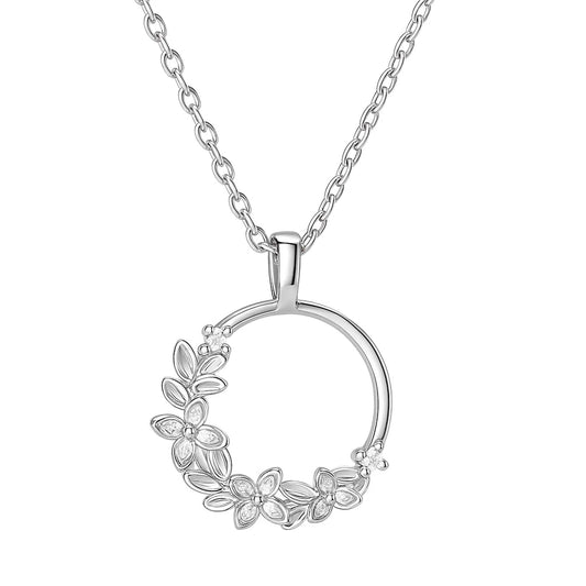 Silver necklace with a floral pendant on a white background