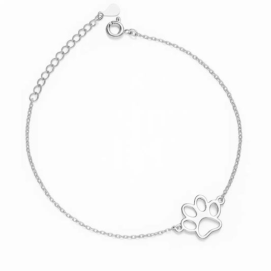 Silver bracelet with a paw print charm on a white background