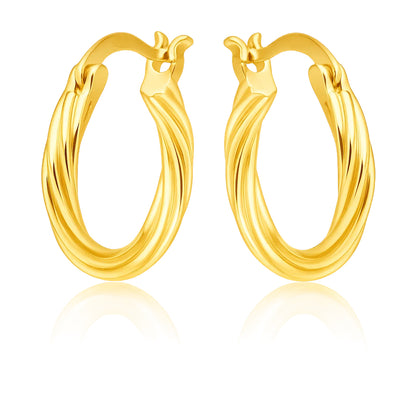 Pair of gold hoop earrings on a white background