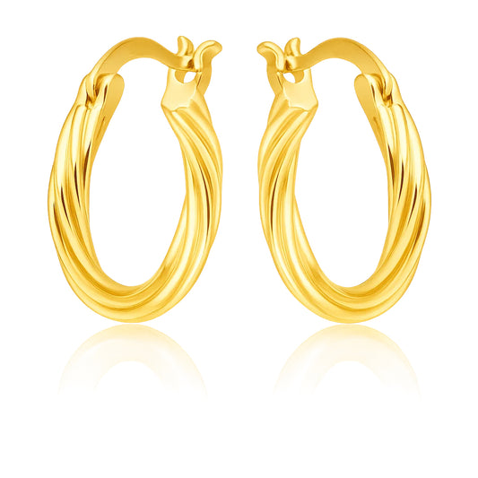 Pair of gold hoop earrings on a white background