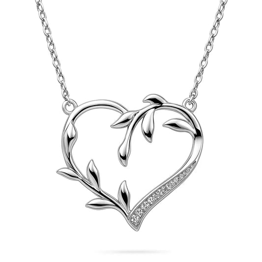 Silver heart-shaped necklace with leaf designs on a white background