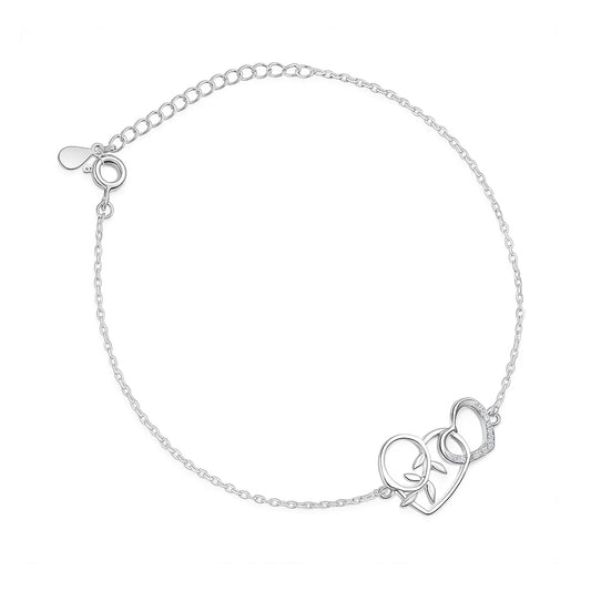 Silver bracelet with a heart and leaf design on a white background