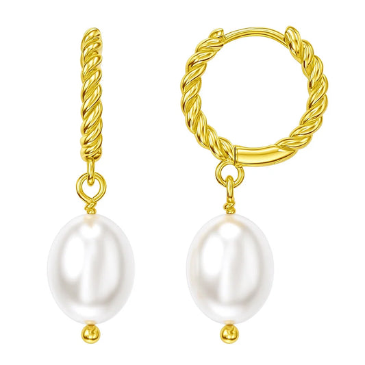 Gold hoop earrings with pearl drops on a white background