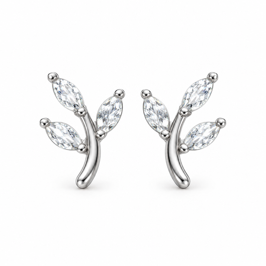 A pair of silver branch stud earrings with marquise-cut clear gemstones, shown on a plain white background.